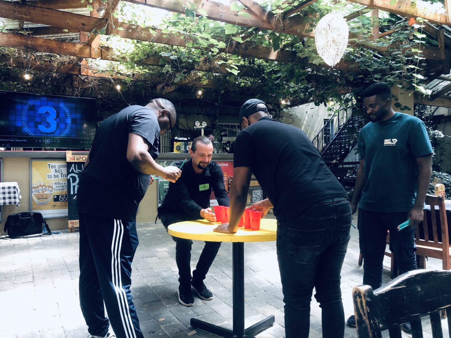 Corporate team members competing in a Minute to Win It game.